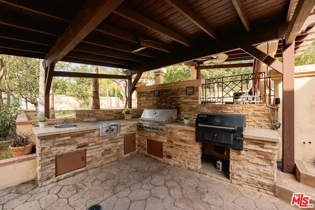 a bedroom with a bed and a large mirror on the dresser
