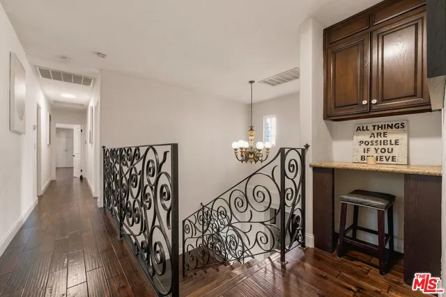a view of a balcony with wooden floor