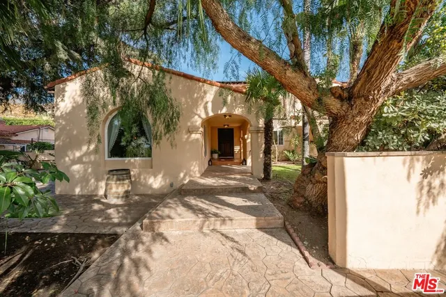 a living room with furniture fireplace and window