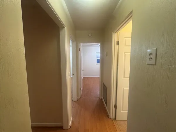 a view of a bathroom from a hallway