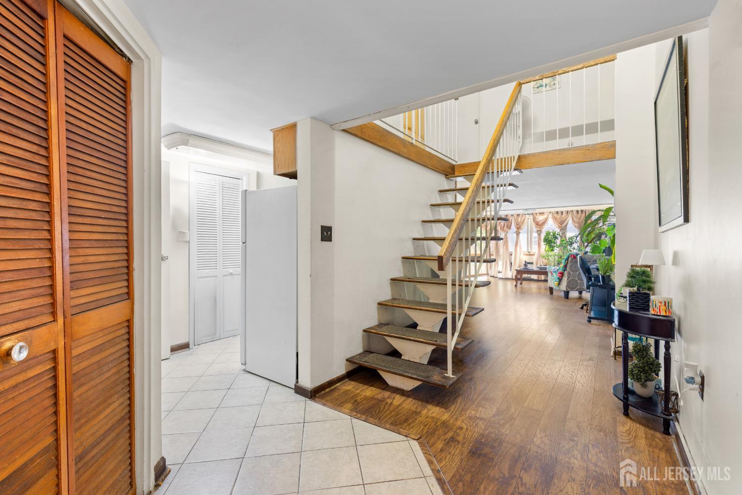 40 Fayette Street, Unit 26 Perth Amboy, NJ 08861 - Photo 13 of 20 a view of entryway with wooden floor and stairs