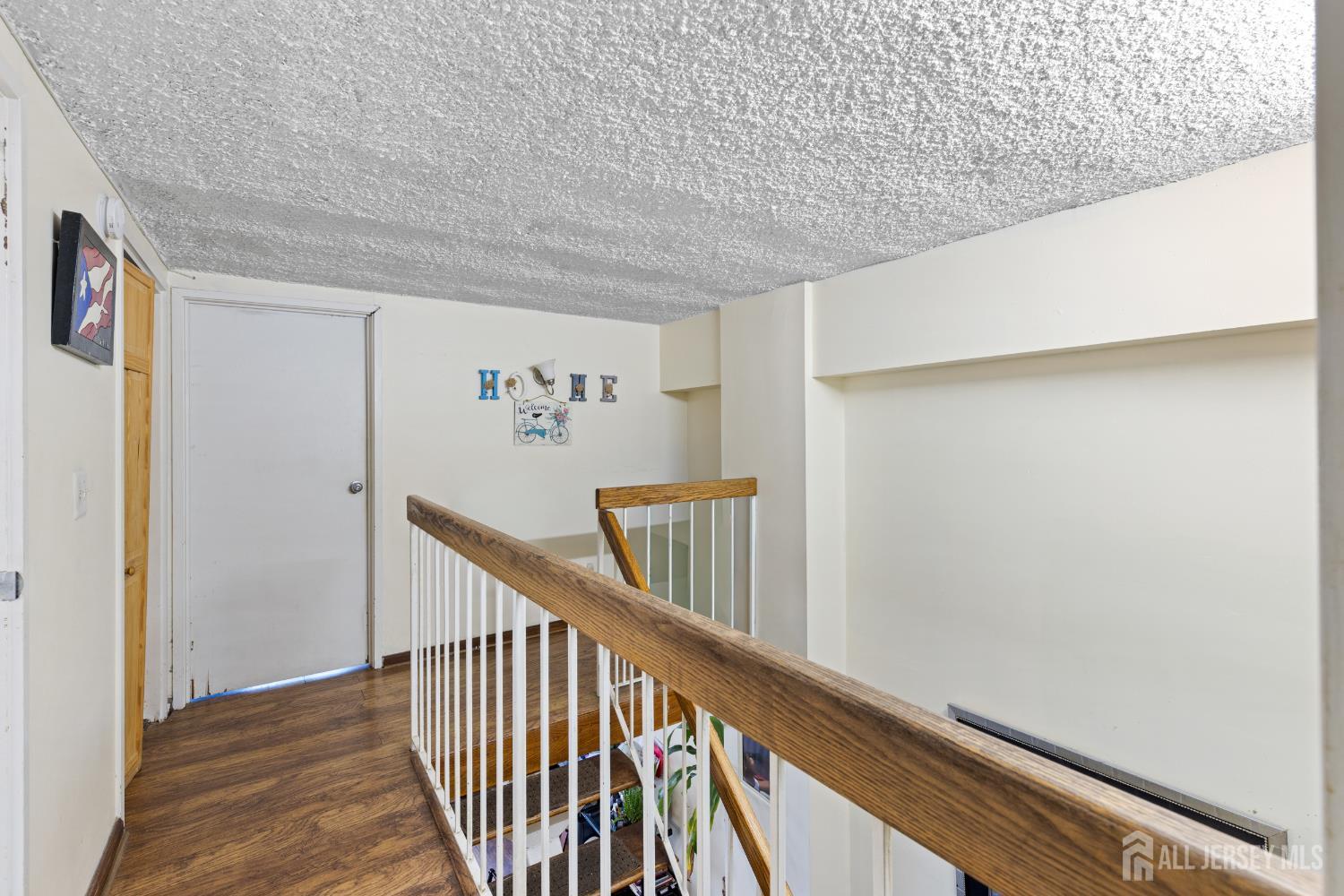 40 Fayette Street, Unit 26 Perth Amboy, NJ 08861 - Photo 14 of 20 a view of staircase with wooden floor