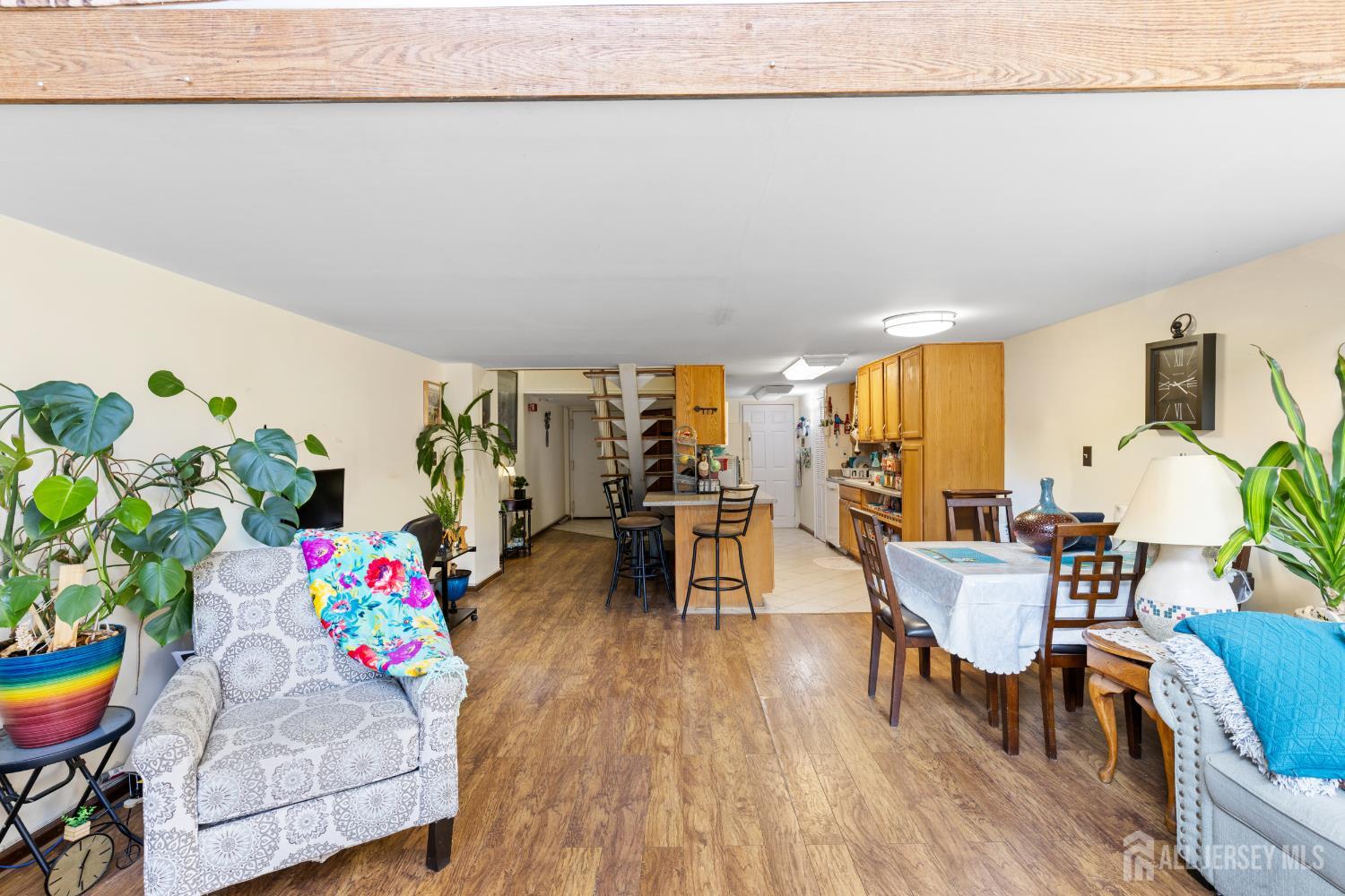 40 Fayette Street, Unit 26 Perth Amboy, NJ 08861 - Photo 3 of 20 a living room with furniture and flowers