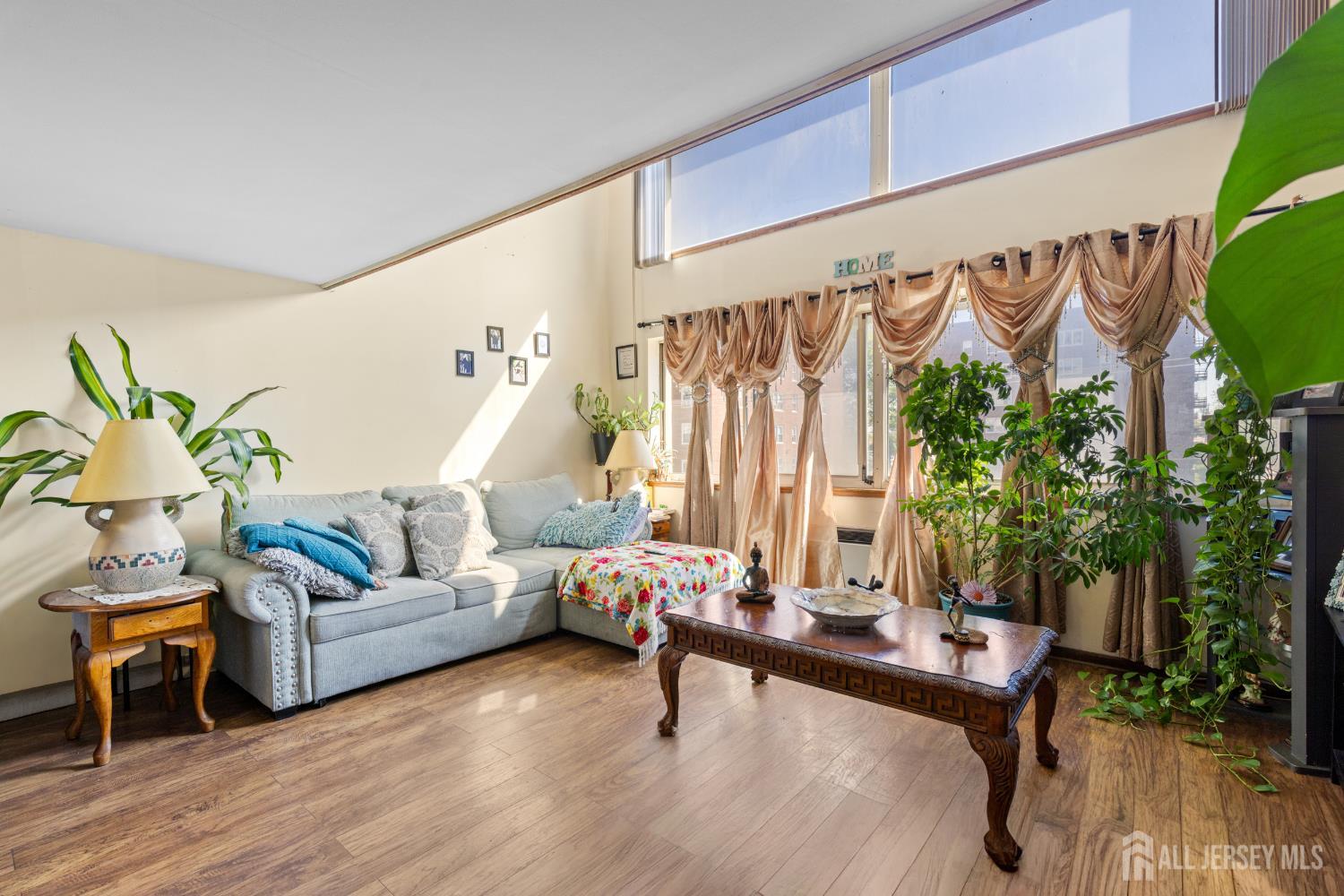 40 Fayette Street, Unit 26 Perth Amboy, NJ 08861 - Photo 5 of 20 a living room with furniture and wooden floor