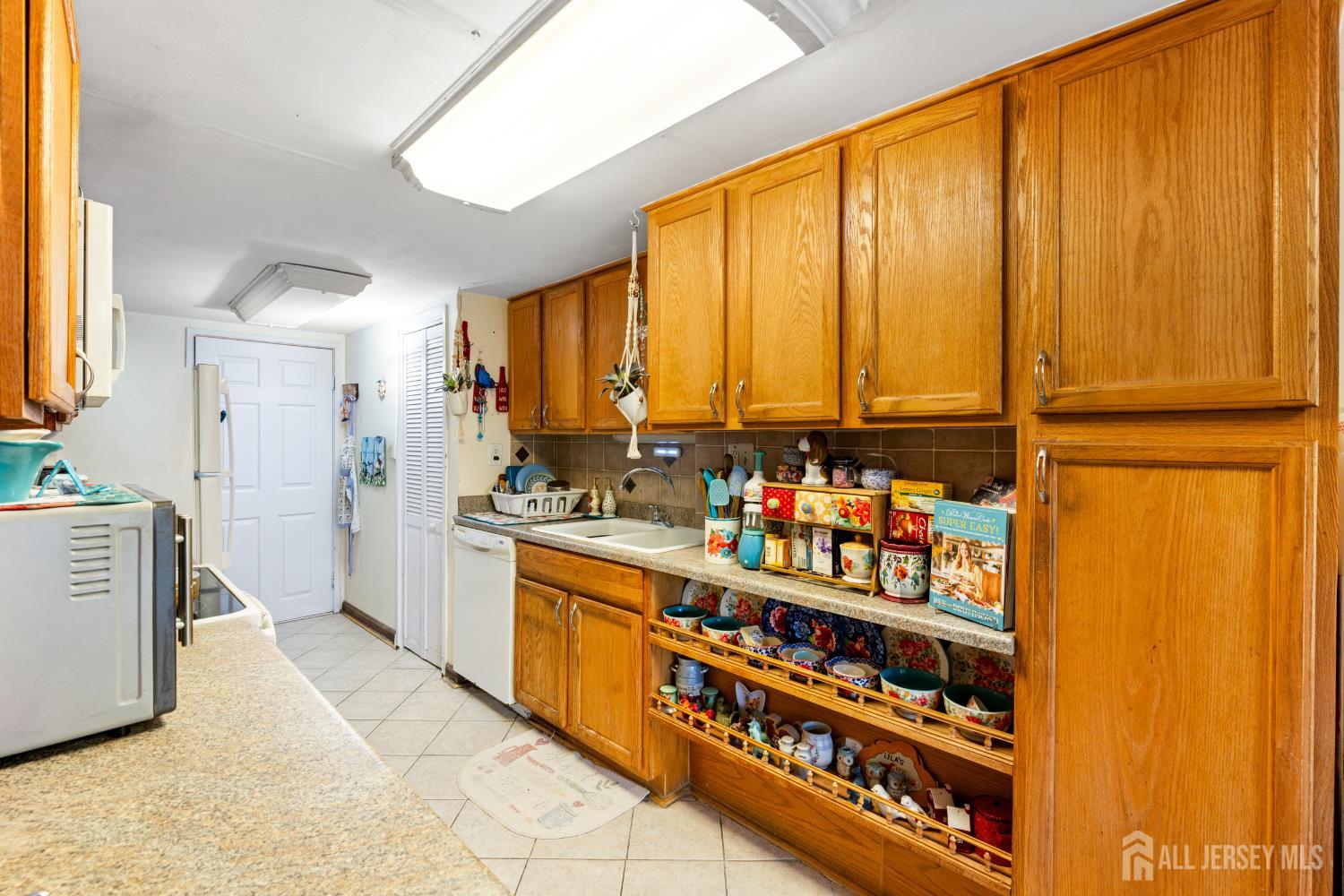 40 Fayette Street, Unit 26 Perth Amboy, NJ 08861 - Photo 8 of 20 a kitchen with stainless steel appliances a refrigerator and a stove