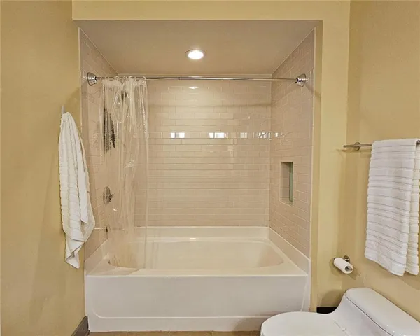 a bathroom with a shower and a bathtub