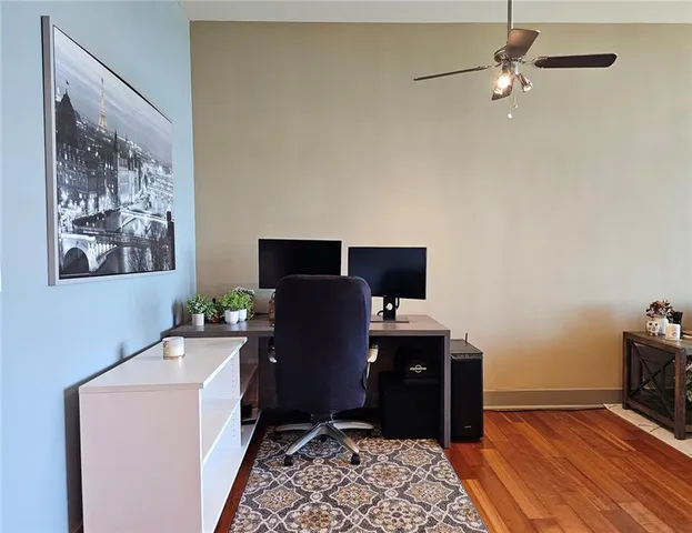 a view of workspace with wooden floor stairs