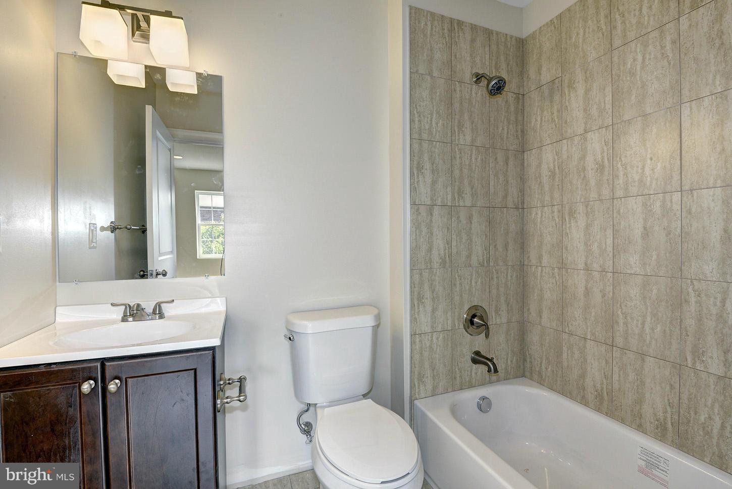 2428 4th Street Northeast Washington, DC 20002 - Photo 13 of 28 a bathroom with a sink a toilet and shower