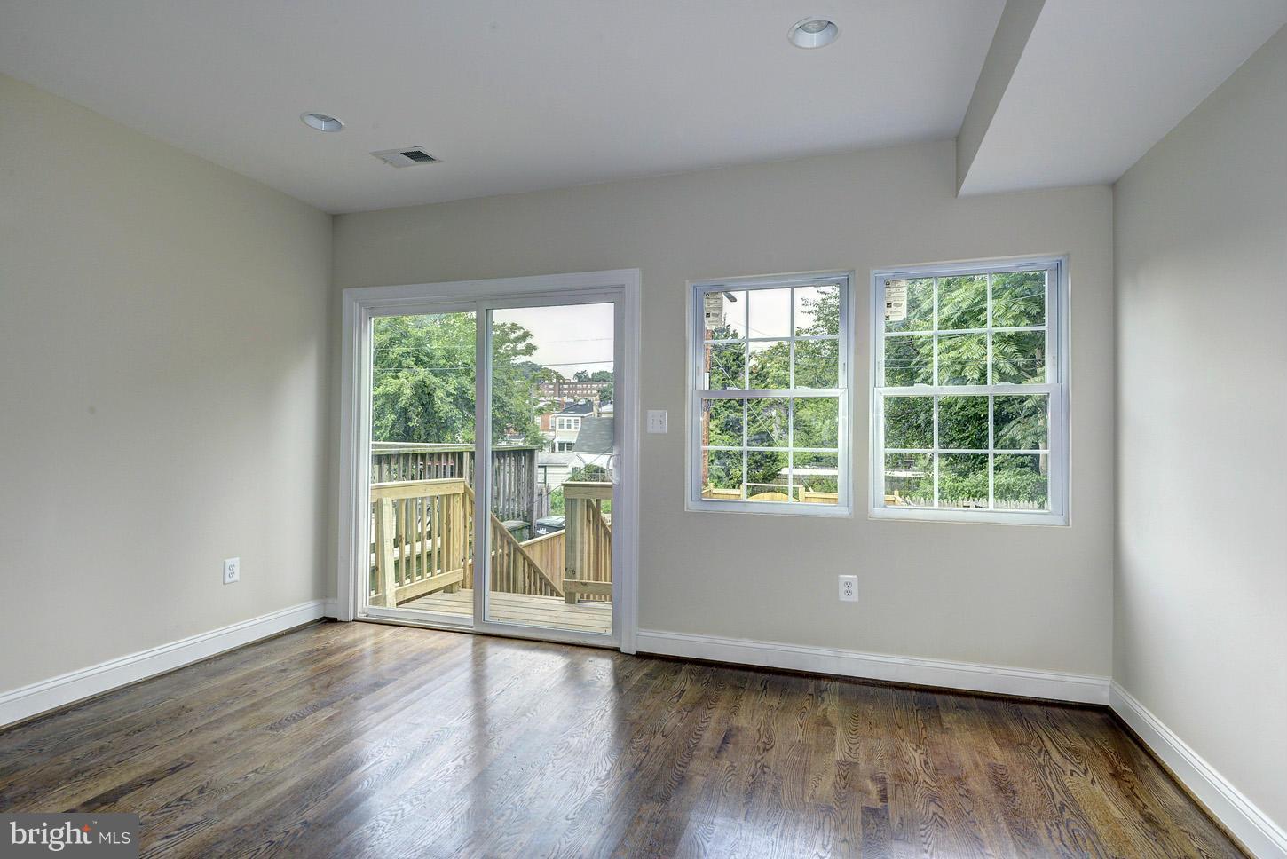 2428 4th Street Northeast Washington, DC 20002 - Photo 14 of 28 a view of an empty room with wooden floor and a window