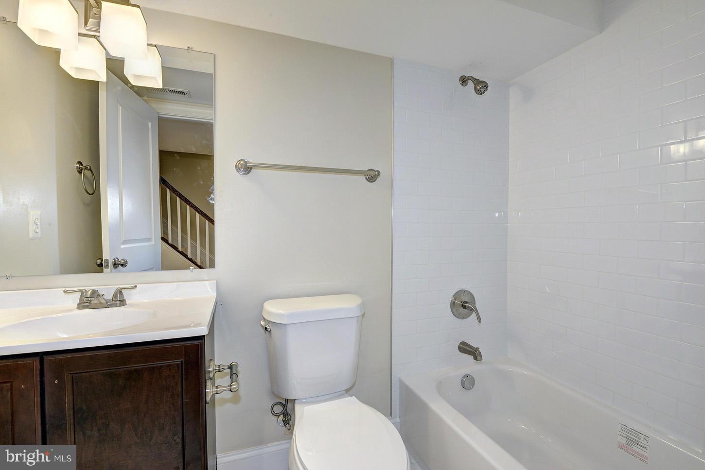 2428 4th Street Northeast Washington, DC 20002 - Photo 23 of 28 a bathroom with a sink toilet vanity and shower