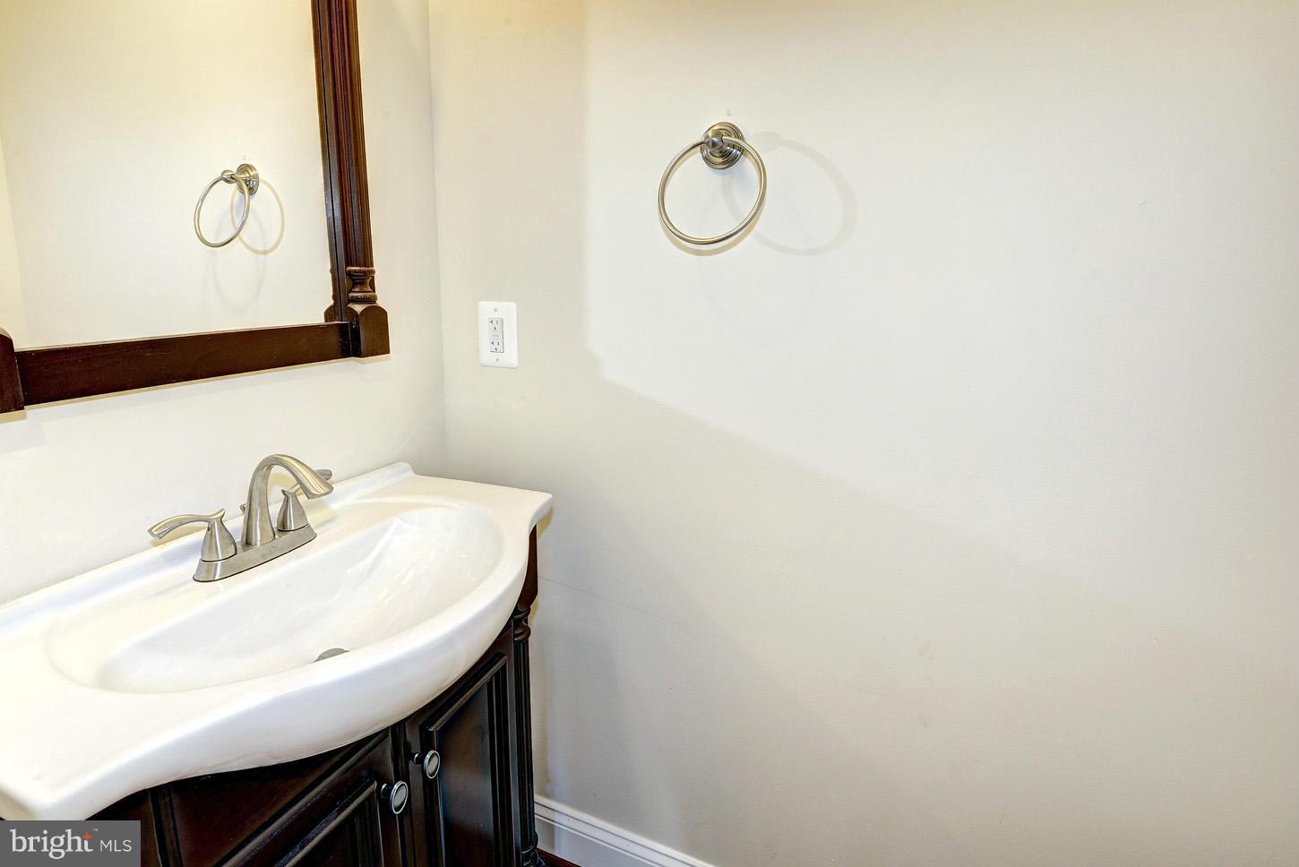 2428 4th Street Northeast Washington, DC 20002 - Photo 8 of 28 a bathroom with a sink and a mirror