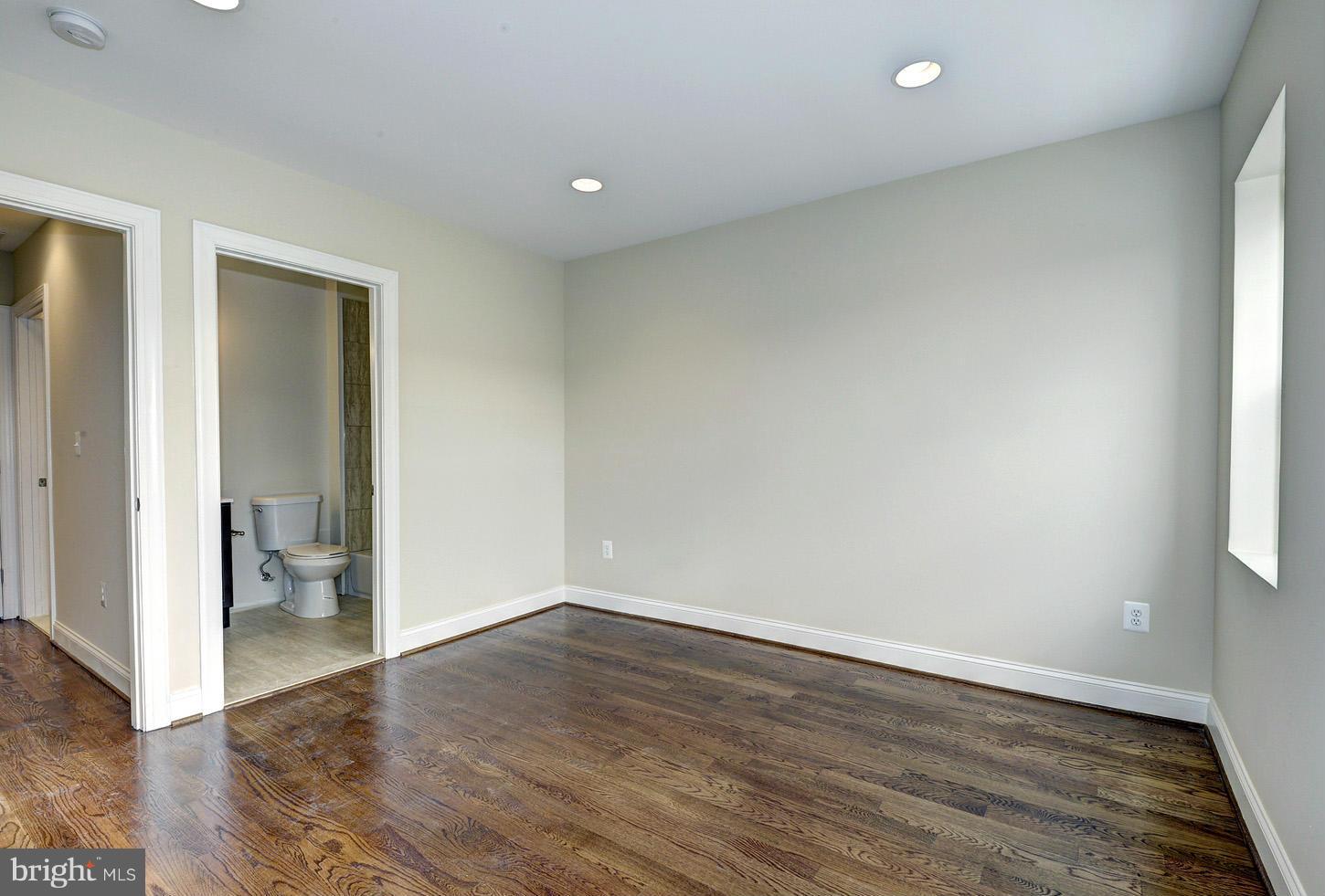 2428 4th Street Northeast Washington, DC 20002 - Photo 10 of 28 an empty room with wooden floor and a window