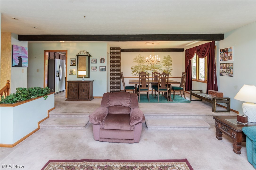 2170 Norton Road Stow, OH 44224 - Photo 27 of 48 Two-tiered living space featuring exposed ceiling beams and light-colored carpeting