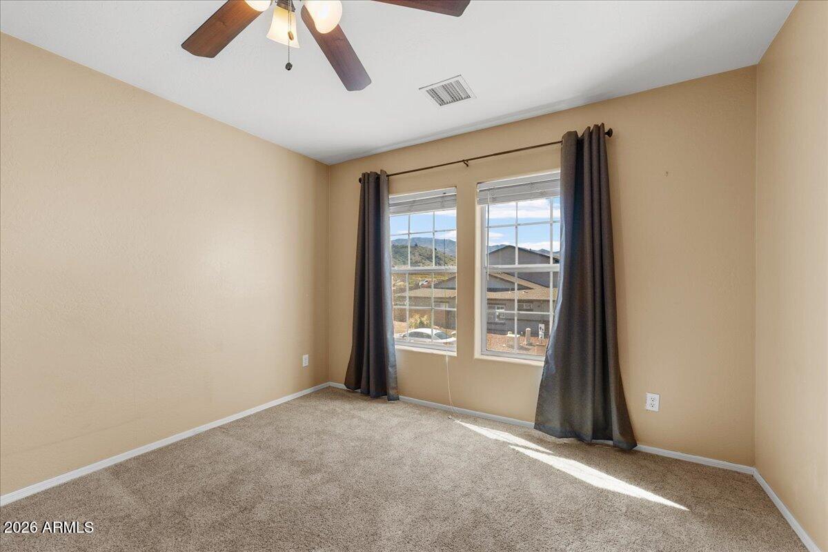 813 Alfonse Road Clarkdale, AZ 86324 - Photo 13 of 41 a view of an empty room with a window