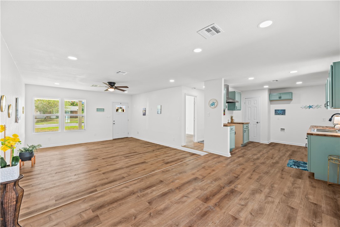 2575 San Angelo Avenue Ingleside, TX 78362 - Photo 11 of 38 a view of a kitchen with microwave and furniture