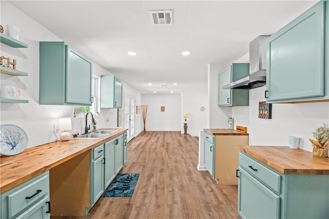 2575 San Angelo Avenue Ingleside, TX 78362 - Photo 14 of 38 a large kitchen with stainless steel appliances granite countertop a sink stove and refrigerator