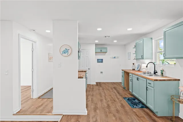 a view of hallway with wooden floor