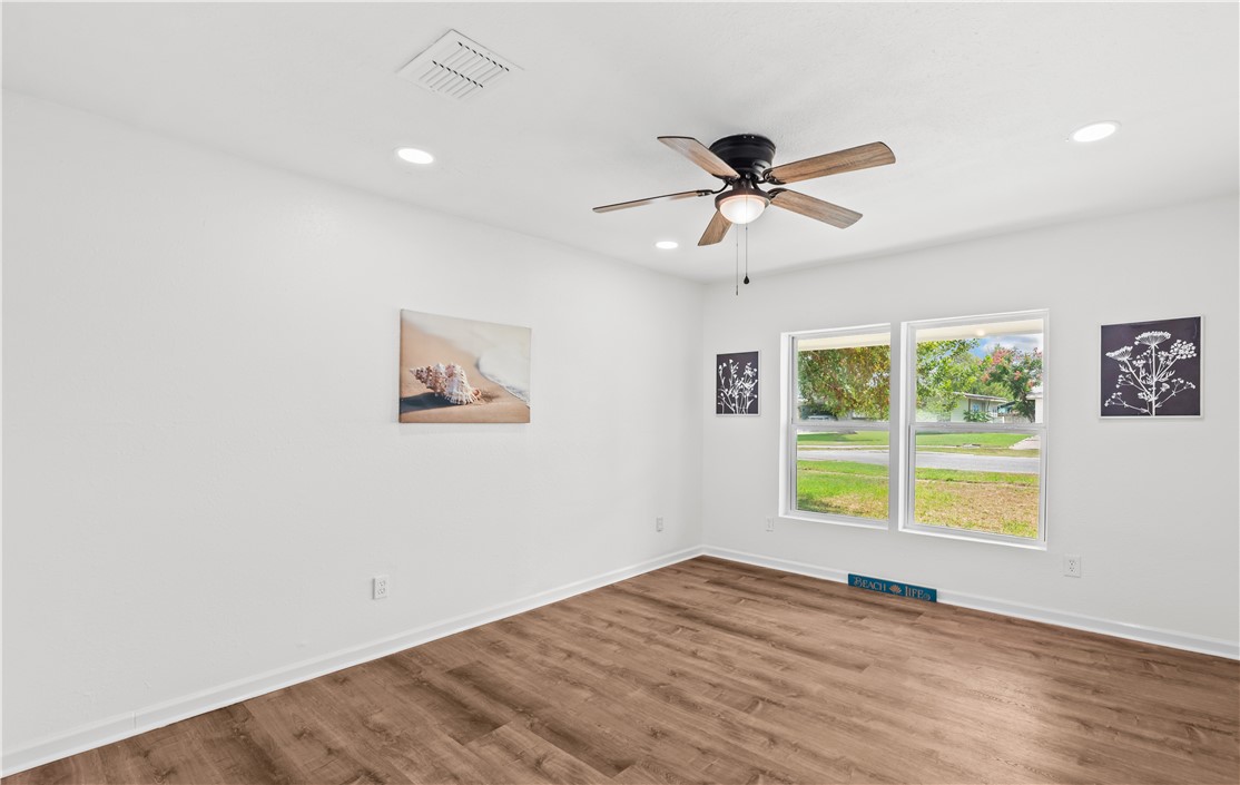 2575 San Angelo Avenue Ingleside, TX 78362 - Photo 17 of 38 a view of a big room with wooden floor and a window
