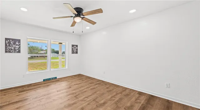 a bathroom with a sink a mirror and vanity