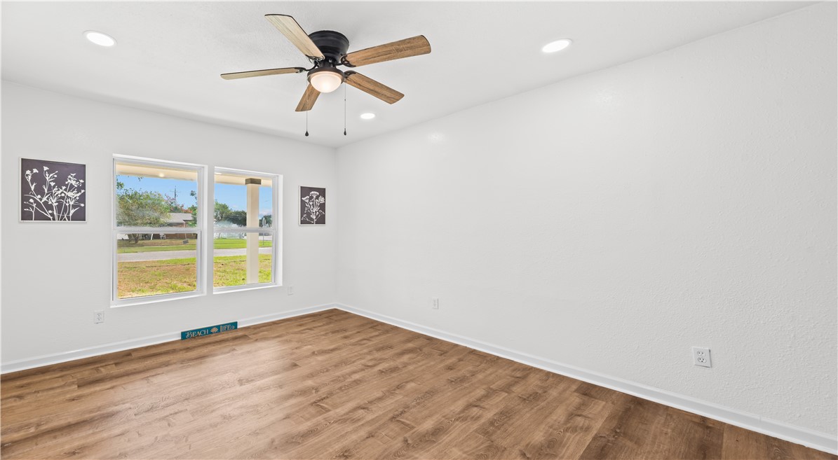 2575 San Angelo Avenue Ingleside, TX 78362 - Photo 18 of 38 an empty room with a window and a fan