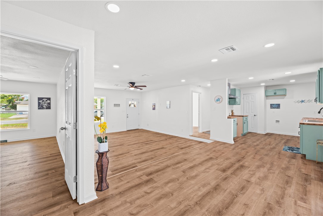 2575 San Angelo Avenue Ingleside, TX 78362 - Photo 26 of 38 a view of kitchen and hall with wooden floor