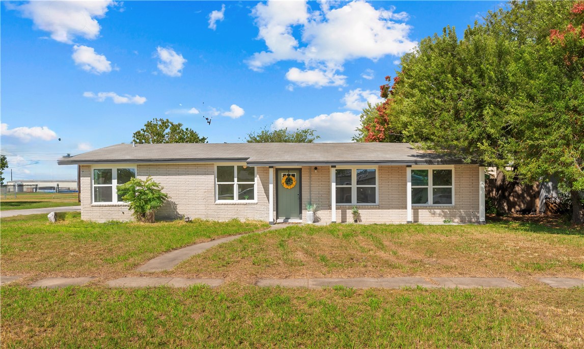 2575 San Angelo Avenue Ingleside, TX 78362 - Photo 3 of 38 a front view of a house with a garden