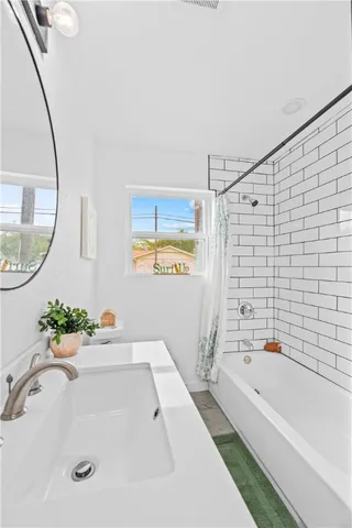 a bathroom with a sink a vanity and a mirror