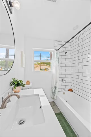 a bathroom with a sink a vanity and a mirror