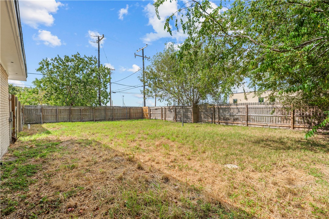 2575 San Angelo Avenue Ingleside, TX 78362 - Photo 34 of 38 a view of a yard with a house in the background