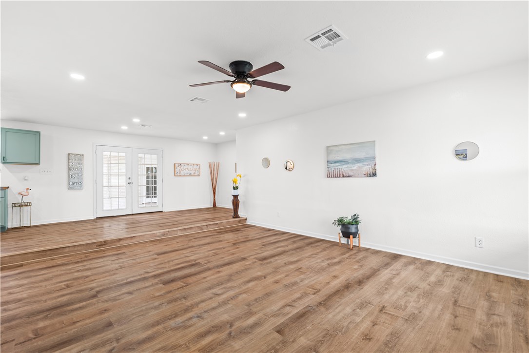2575 San Angelo Avenue Ingleside, TX 78362 - Photo 8 of 38 a view of empty room with wooden floor and fan