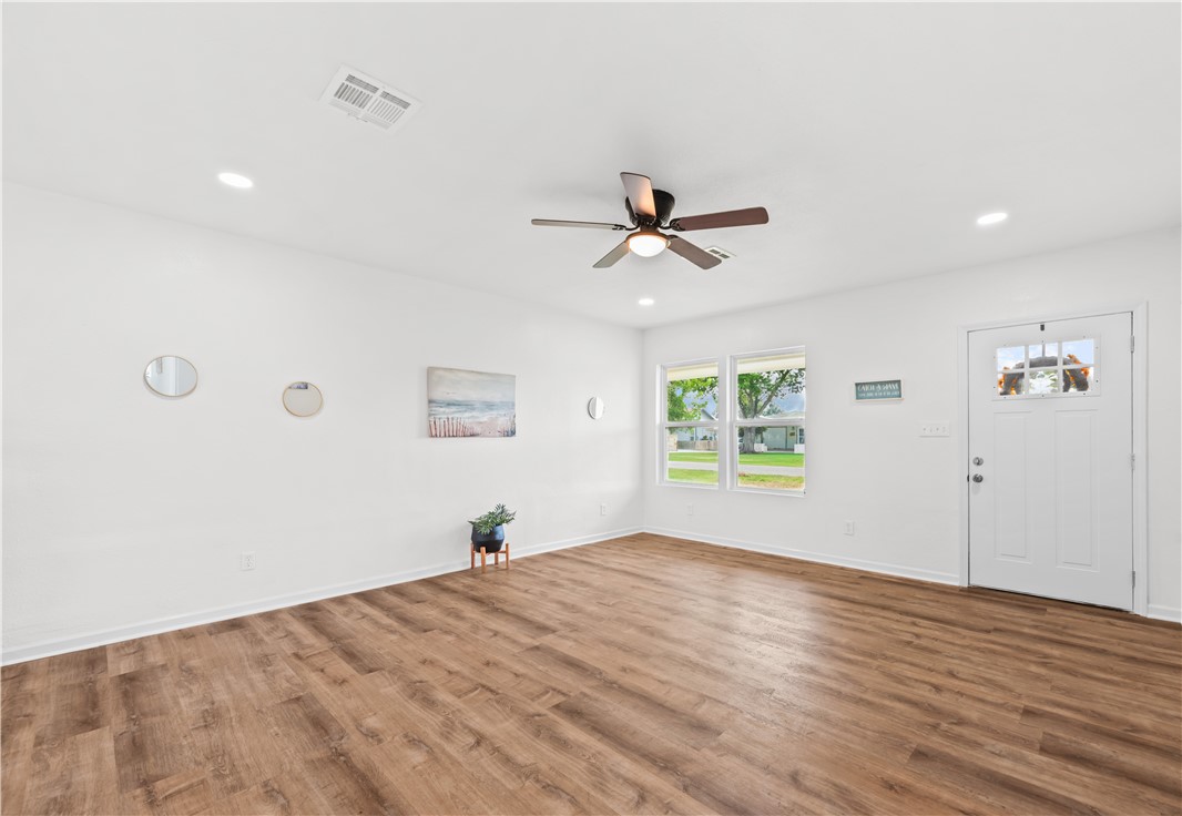 2575 San Angelo Avenue Ingleside, TX 78362 - Photo 10 of 38 a view of a big room with wooden floor and windows