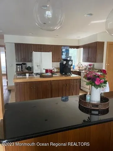 a kitchen with a stove and a refrigerator