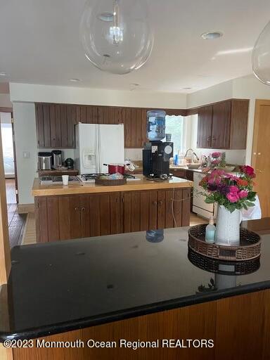 7 Slocum Place Oakhurst, NJ 07755 - Photo 1 of 14 a kitchen with a stove and a refrigerator