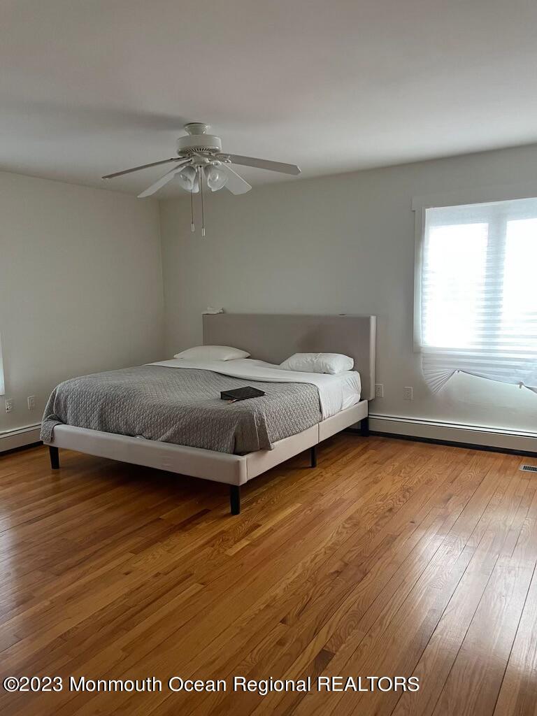 7 Slocum Place Oakhurst, NJ 07755 - Photo 11 of 14 a bed sitting in a room next to a window