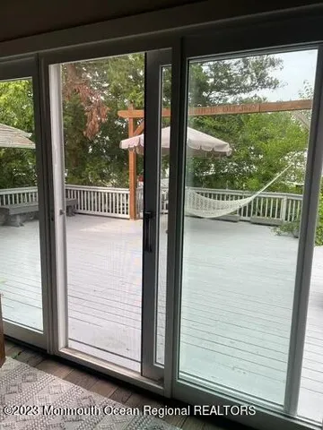a view of a glass door and a window