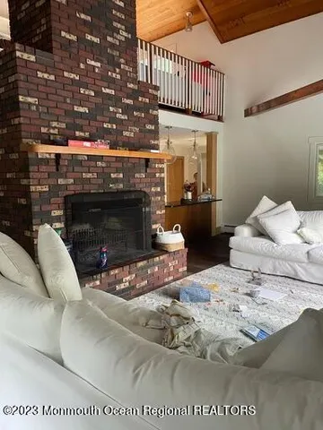 a bedroom with a bed and a fireplace