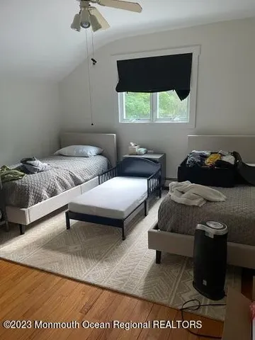 a bedroom with bed and window