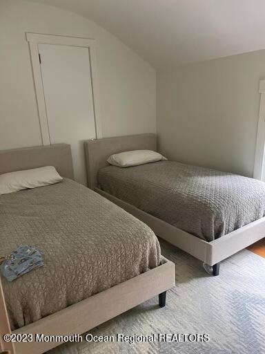 7 Slocum Place Oakhurst, NJ 07755 - Photo 9 of 14 a bedroom with a bed rug and wall painting