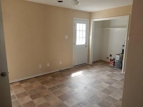 a view of an empty room with a window