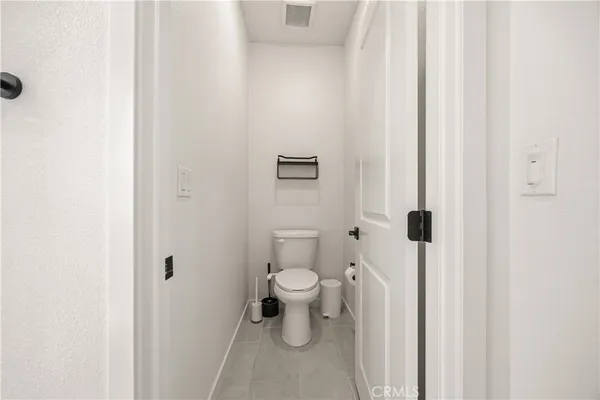 a bathroom with a toilet and a view