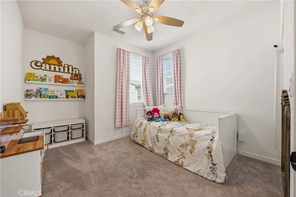 a bedroom with furniture and a window
