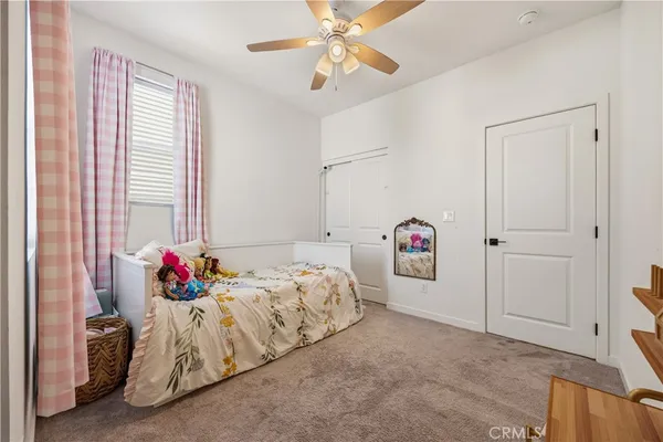a bed room with a bed and a chandelier