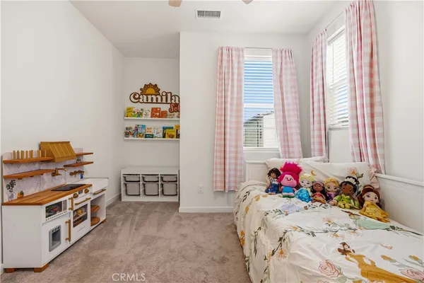 a bed room with a bed and a window