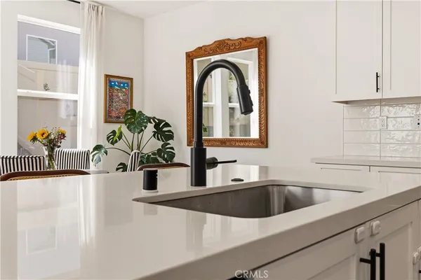 a view of a kitchen with a sink and a window