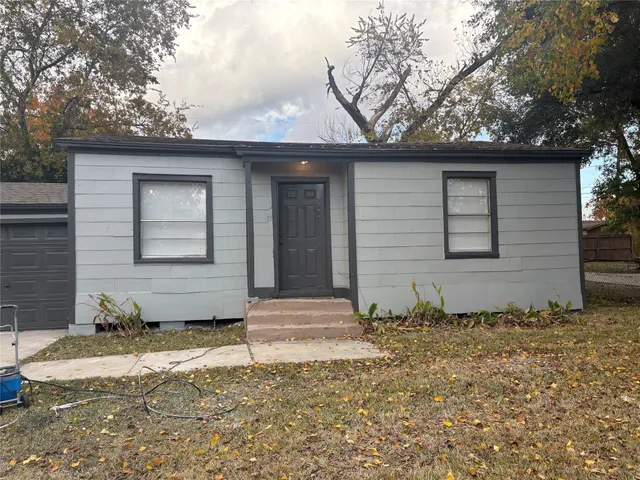 a house with trees in the background