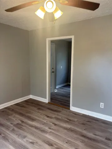 a kitchen with granite countertop a sink and cabinets