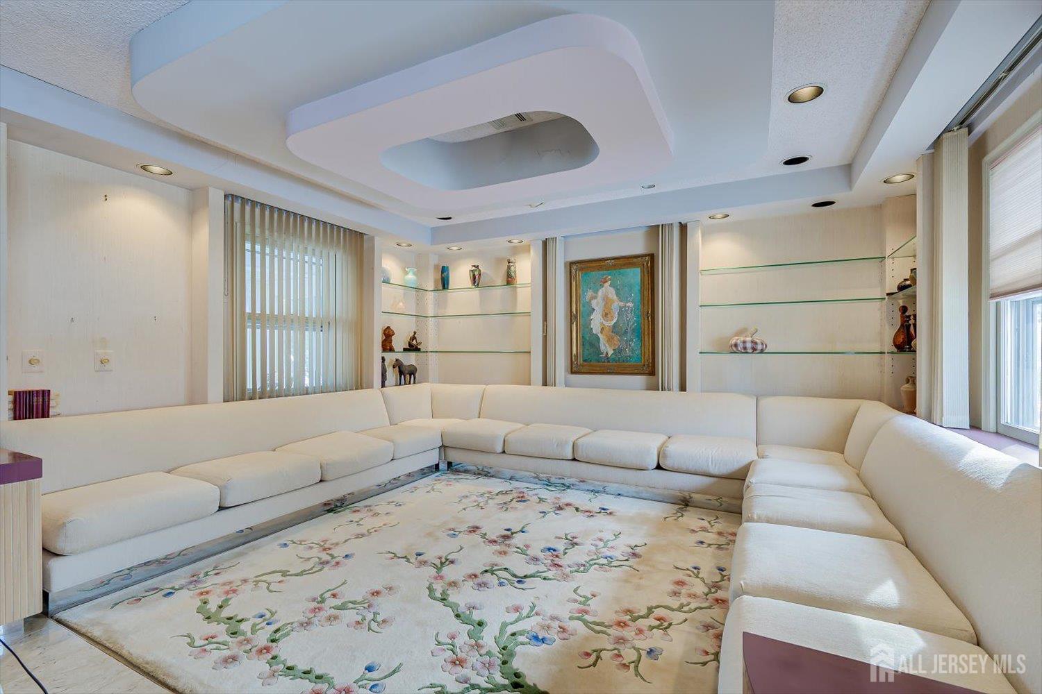 628A Windsor Way, Unit B Monroe Township, NJ 08831 - Photo 12 of 50 a living room with furniture and a large window
