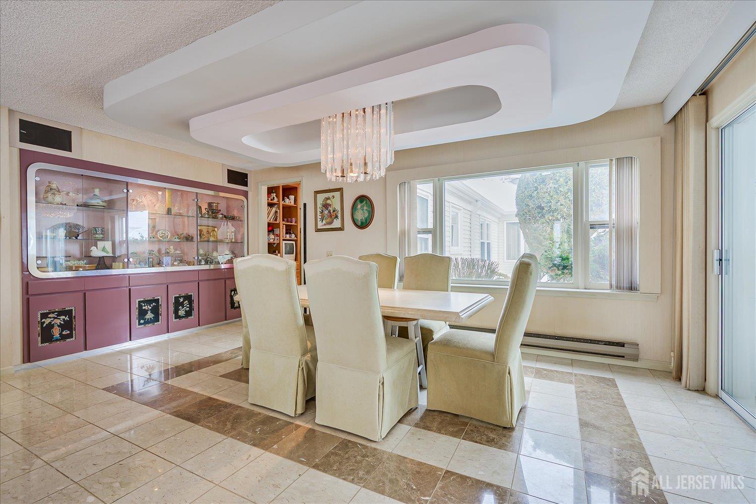 628A Windsor Way, Unit B Monroe Township, NJ 08831 - Photo 14 of 50 a view of a dining room with furniture window and outside view