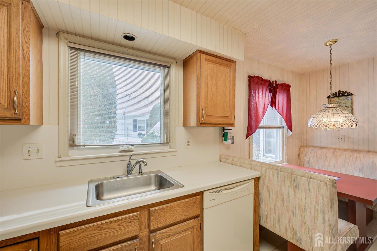 628A Windsor Way, Unit B Monroe Township, NJ 08831 - Photo 19 of 50 a kitchen with a sink cabinets and window