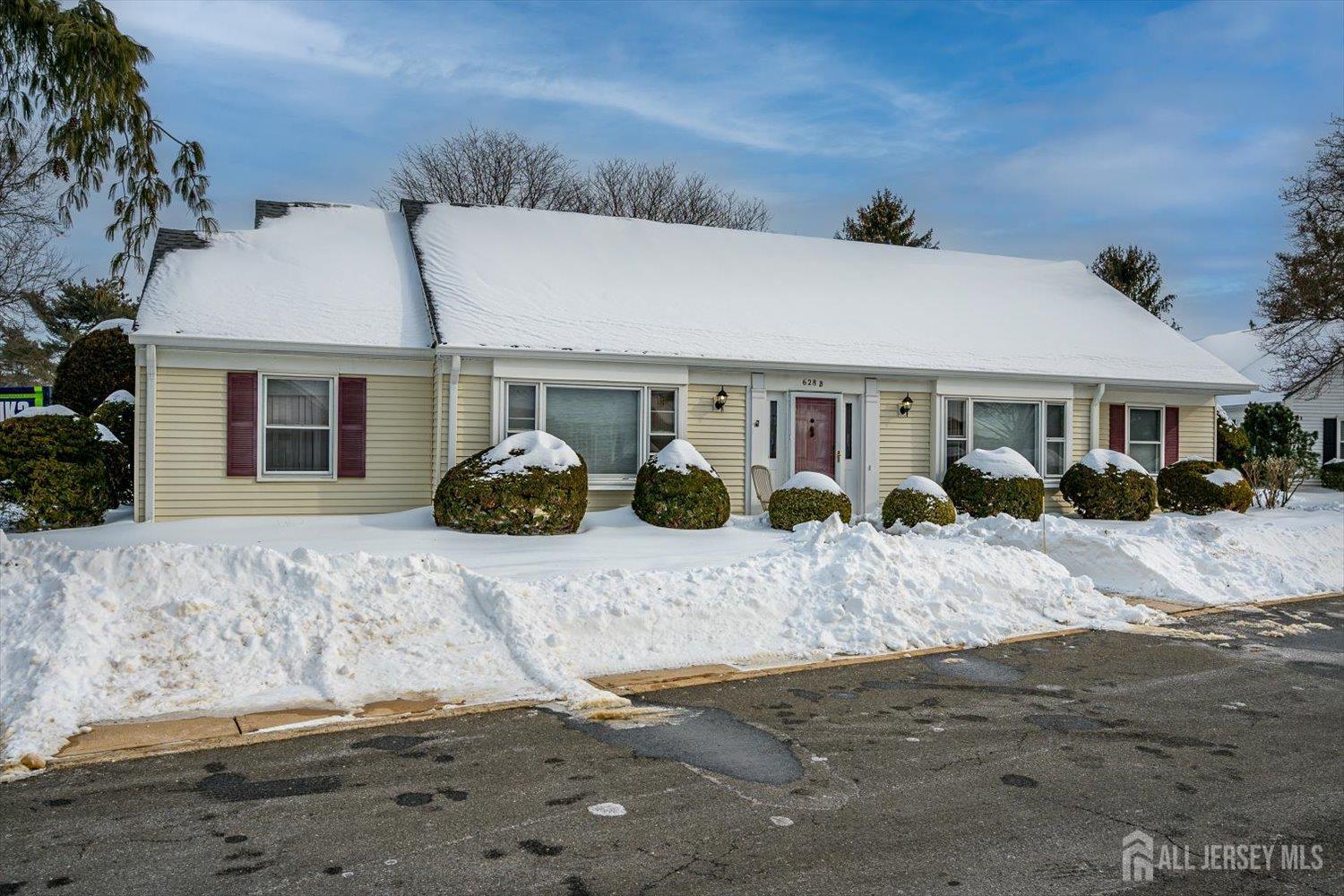 628A Windsor Way, Unit B Monroe Township, NJ 08831 - Photo 2 of 50 a front view of a house with road